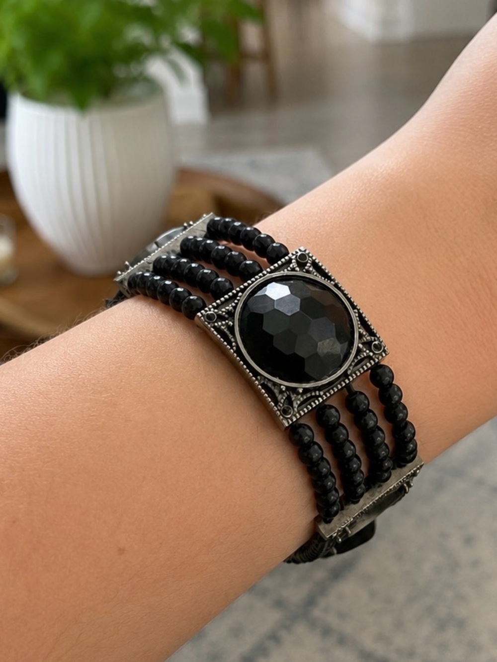 Black stretchy beaded bracelet with silver accents
